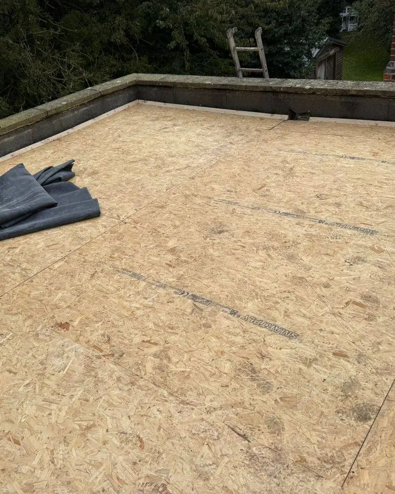 New OSB deck on a flat roof with the EPDM rubber membrane ready to bond