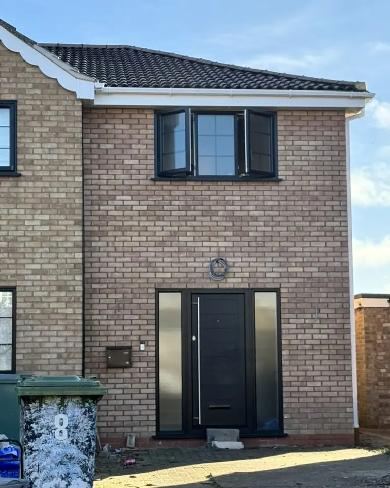 Completed house with new roof tiles, fascias and guttering, Peterborough